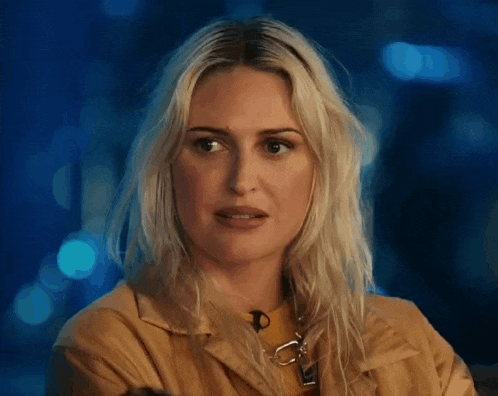 a woman says yeah whatever in front of a blurry background