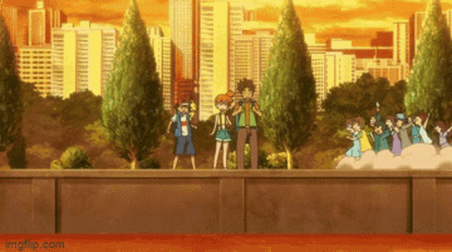 a group of people standing on top of a wall in front of a city skyline