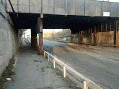 a bridge over a road with a sign on the side that says ' a '