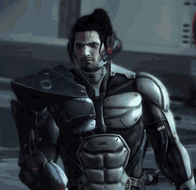 a man in a futuristic armored suit has a sticker on his chest that says ' a ' on it