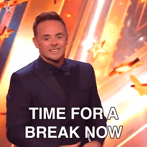 a man in a suit with the words time for a break now behind him