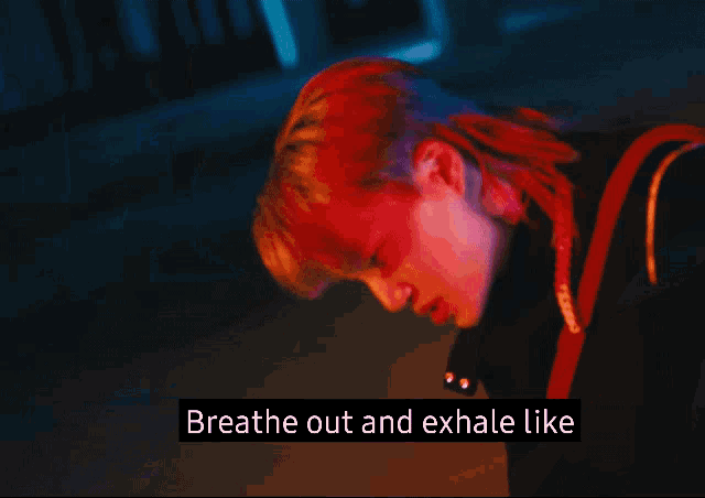 a close up of a person 's face with the words breathe out and exhale like below it