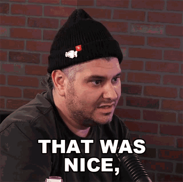 a man wearing a black beanie and a black shirt says that was nice