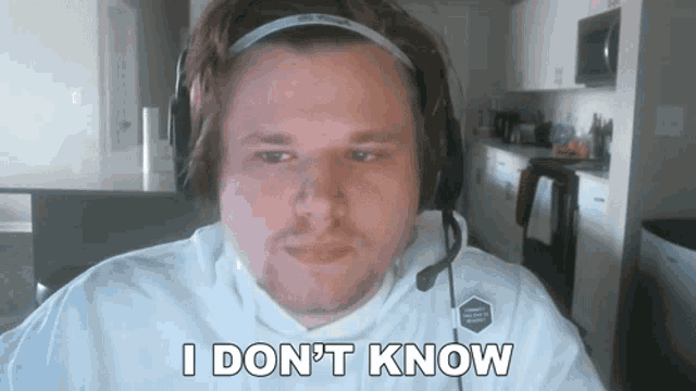 a man wearing headphones and a microphone says i don t know .