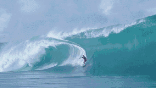 a surfer is riding a wave in the ocean