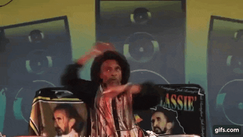a man is standing in front of a sign that says les selassie