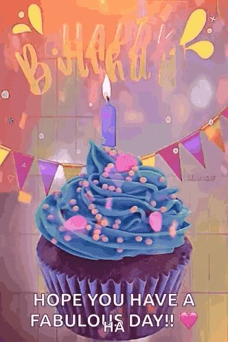 a birthday cupcake with blue frosting and sprinkles and a candle .