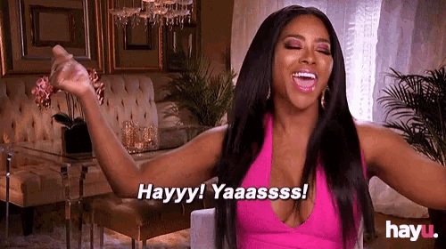 a woman in a pink dress says hayyy yaaasss
