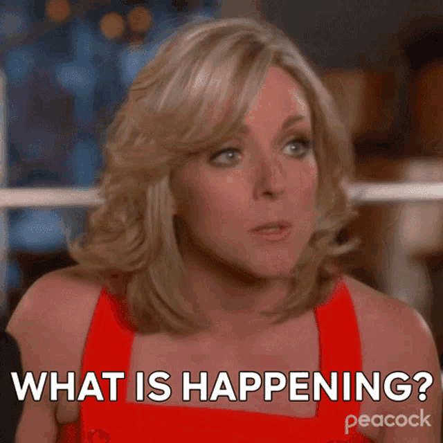 a woman in a red dress says what is happening on peacock
