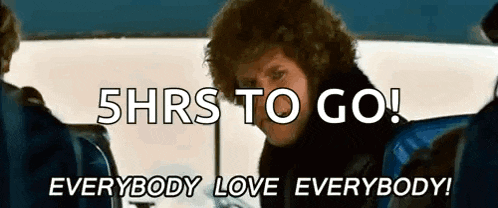 a man with curly hair is sitting on a bus and says 5hrs to go everybody love everybody