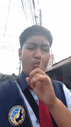 a man wearing a vest that says ' philippines ' on the front
