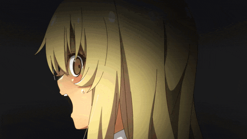 a close up of a girl 's face with a surprised look on her face