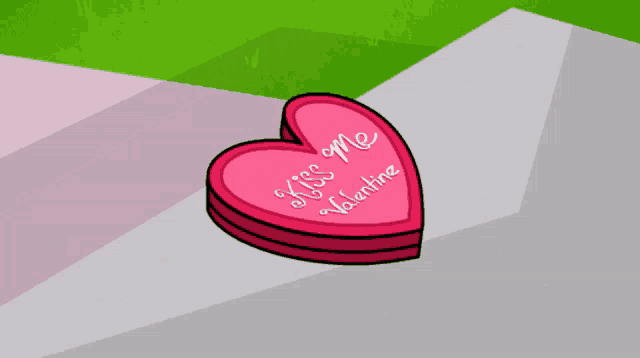 a pink heart with the words kiss me valentine written on it