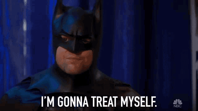 a man in a batman costume is saying i 'm gonna treat myself .