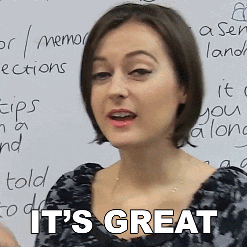 a woman says " it 's great " in front of a whiteboard