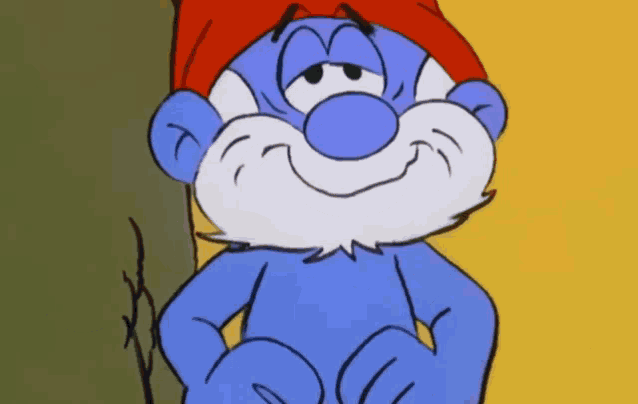 a blue smurf with a red hat and beard