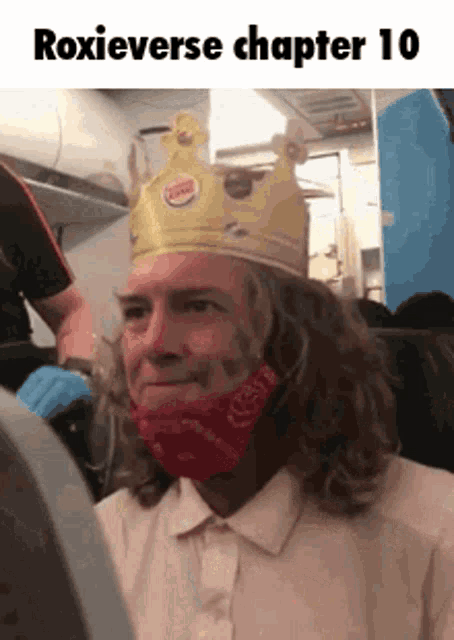a man is wearing a burger king crown and a red bandana .