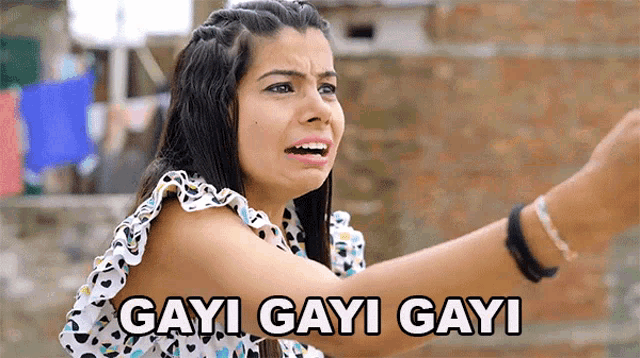 a woman is making a funny face and saying gayi gayi gayi in a foreign language .