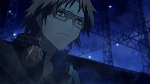 a man wearing glasses is looking at something in the distance