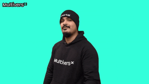 a man wearing a beanie and a hoodie that says multivers on it