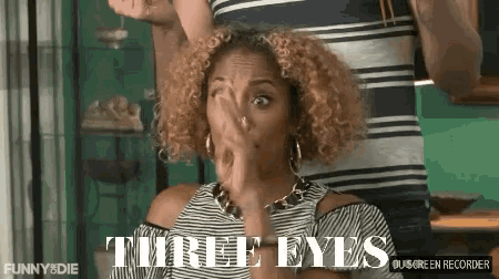 a woman with curly hair covering her face with her hand and the words " three eyes " on the bottom right