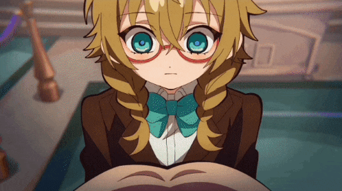 a girl with glasses and a blue bow tie looks at the camera