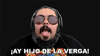 a man with a beard wearing sunglasses and headphones says " ay hijo de la verga "