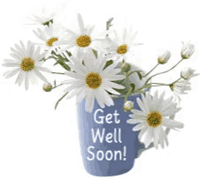 a blue mug with daisies and the words get well soon on it