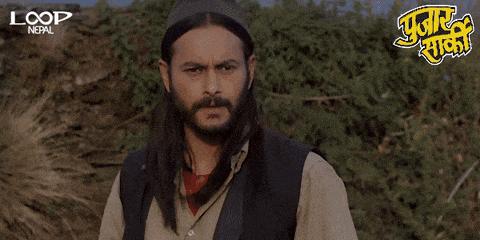 a man with long hair and a beard says " loop nepal " on the bottom