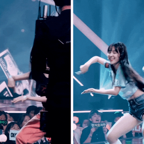 a woman in a blue shirt is dancing in front of a crowd with a sign that says " off "