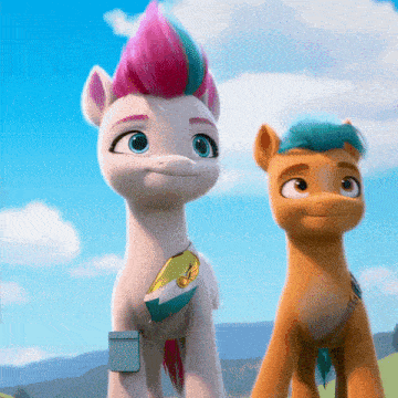 two ponies are standing next to each other and one has a pink mohawk