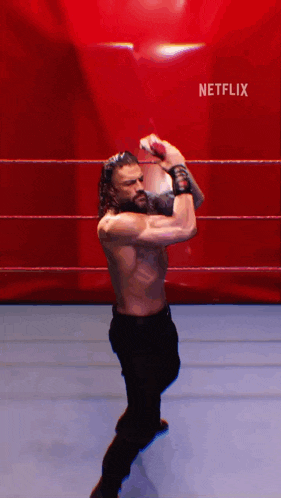 a man in a wrestling ring with a netflix logo on the bottom right