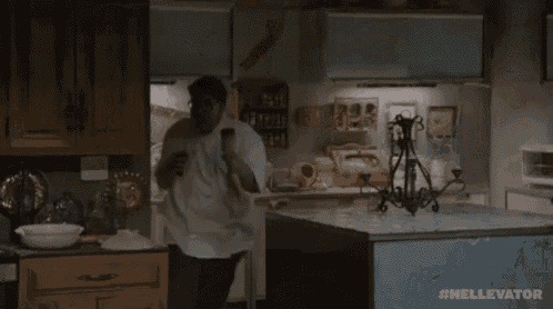 a man in a lab coat is holding a bottle of liquid in his hand and screaming .