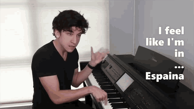 a young man playing a piano with the words " i feel like i 'm in espana "
