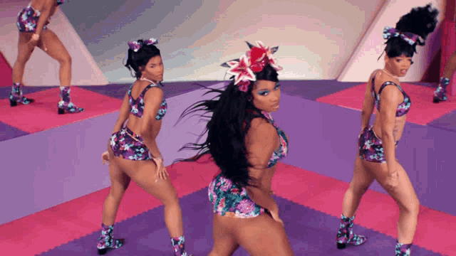 a woman with a flower in her hair is dancing