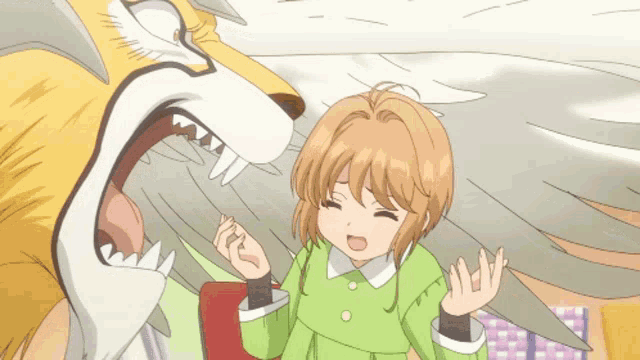 a girl in a green dress is standing next to a fox with its mouth open