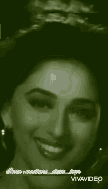 a close up of a woman 's face with the words vivavideo written on the bottom