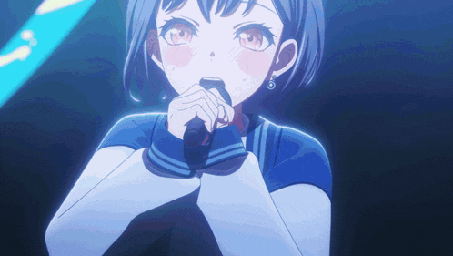 a girl is singing into a microphone with a blue background
