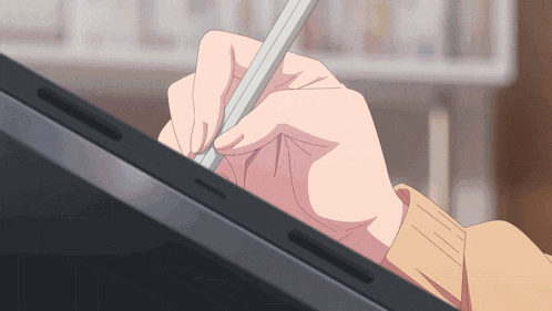 a hand is holding a pen and writing on a screen