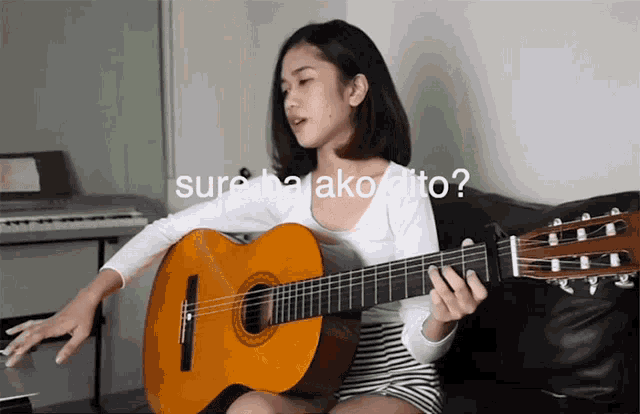 a girl singing and playing a guitar with the words sure ba ako dito