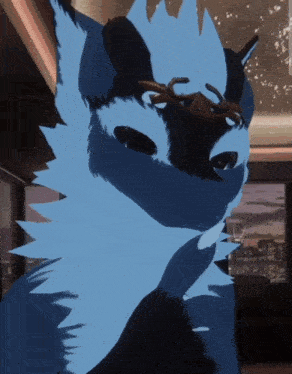 a close up of a blue and black furry animal with a crown on its head