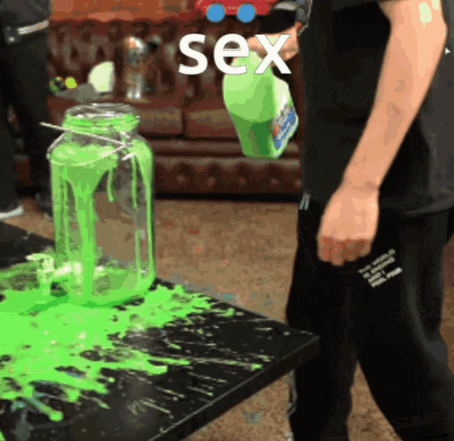 a person pouring liquid into a jar with the word sex written on it