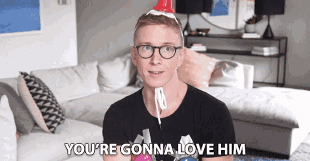 a man with glasses and a party hat says you 're gonna love him