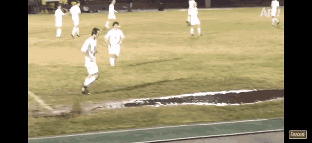 a soccer field with a subscribe button on the bottom right