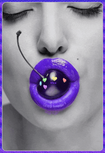 a black and white photo of a woman with purple lips and a cherry in her mouth