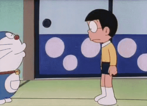 doraemon and nobita are standing next to each other in a cartoon .