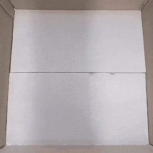 a box filled with pink and blue styrofoam