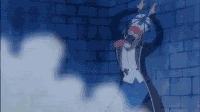 a man is standing in front of a brick wall with his tongue hanging out .