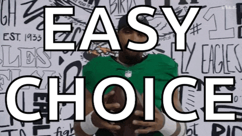a man in a green jersey holds a football in front of a wall that says easy choice on it