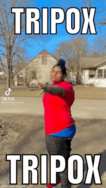a woman in a red shirt and blue shorts is standing in front of a house with a caption that says tripox .